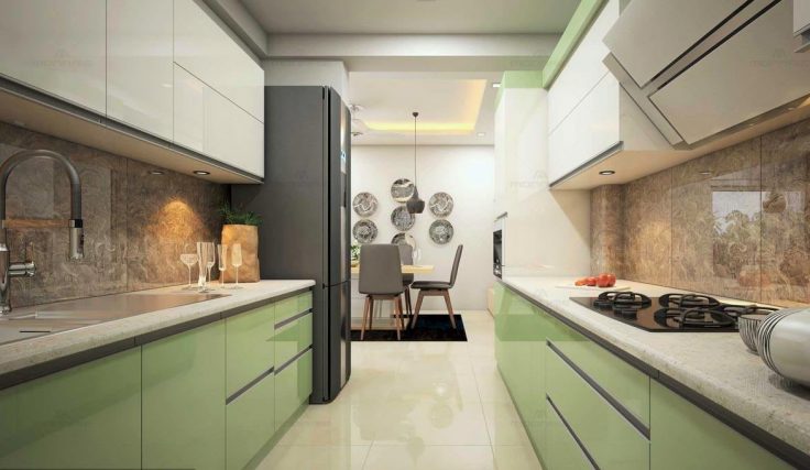 Parallel kitchen with green and white cabinets and marble countertop