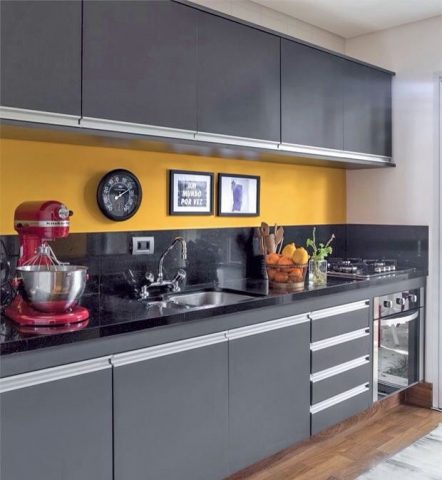 Modern grey and yellow kitchen with handleless cabinets