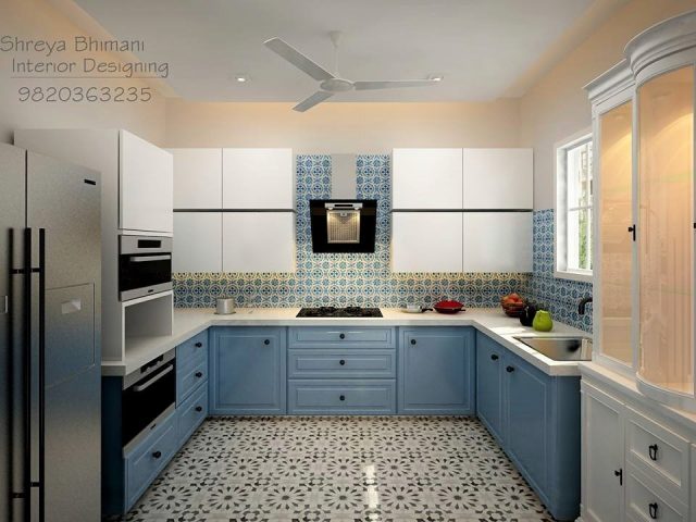 U-shaped kitchen with blue cabinets and patterned flooring and backsplash
