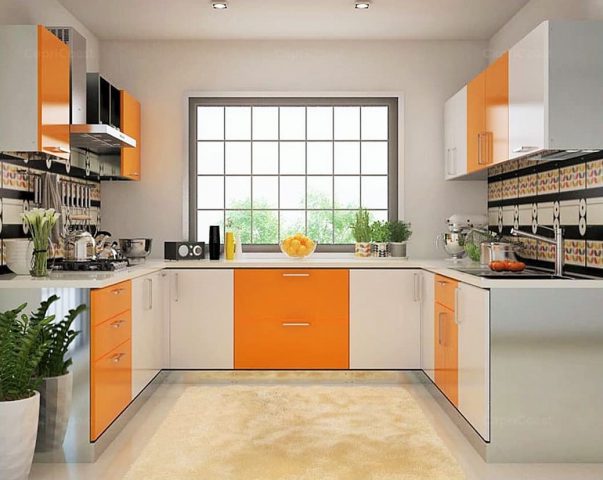 U-shaped kitchen with orange and white cabinets and large window