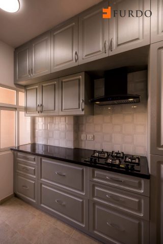 Grey kitchen with double stacked cabinets