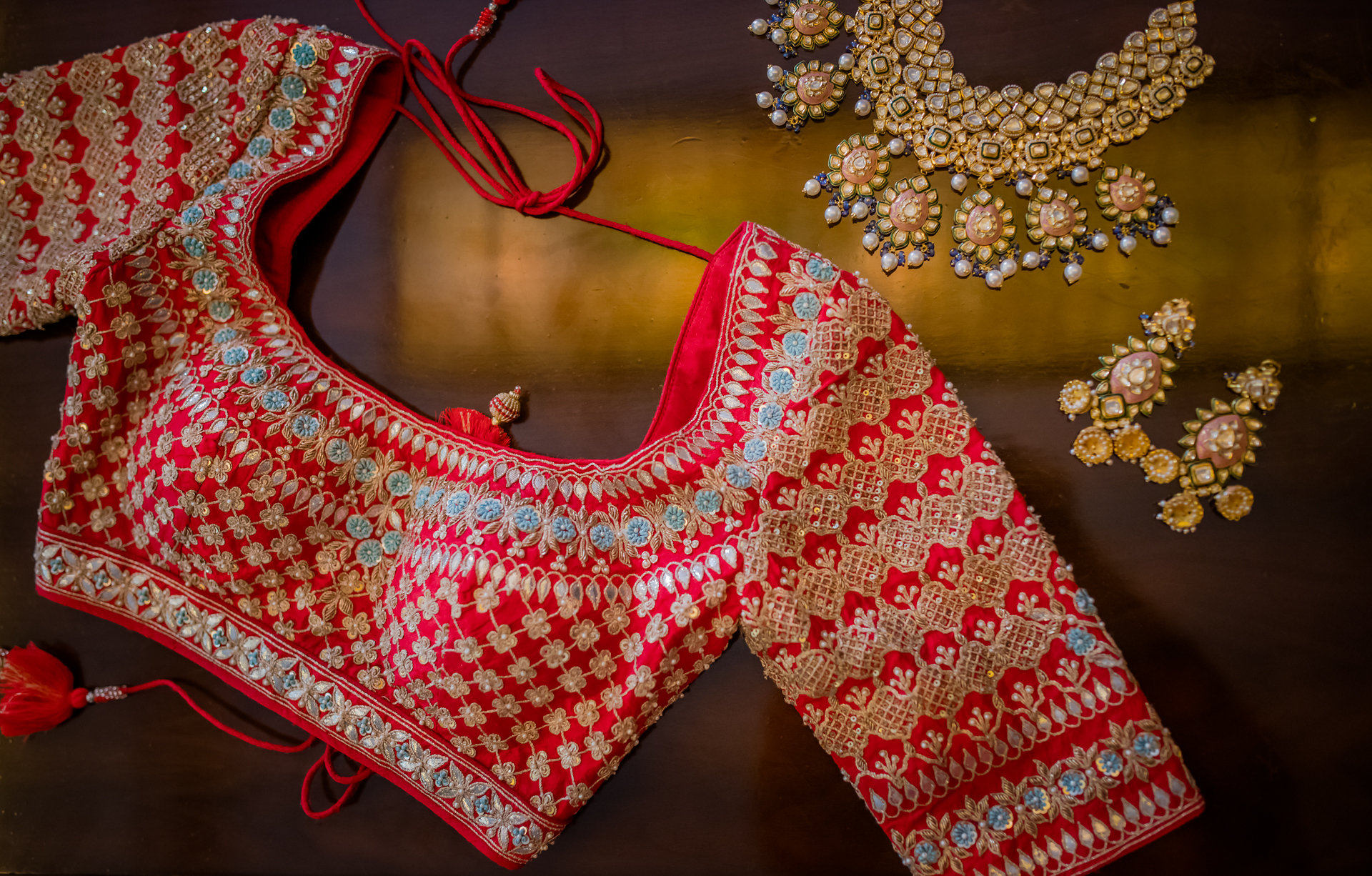 Red blouse design with slightly long sleeves