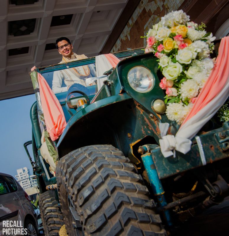 Indian wedding groom entrance on a jeep