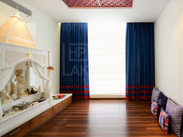 marble mandir designs with wooden flooring